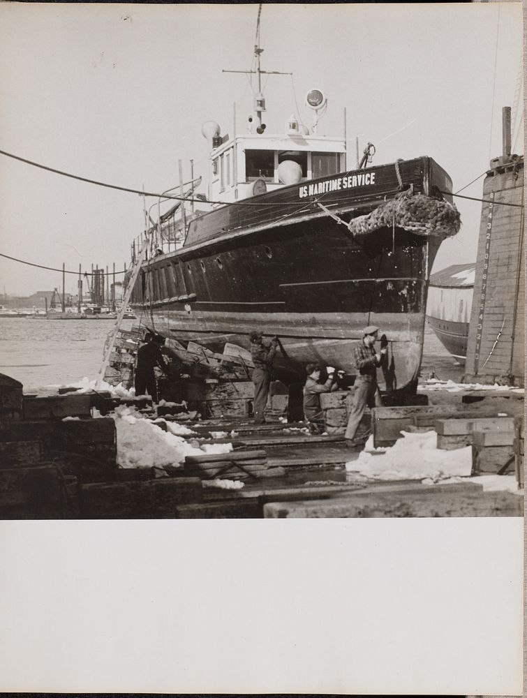 Four men repair the lower half of a docked boat by Arnold Eagle