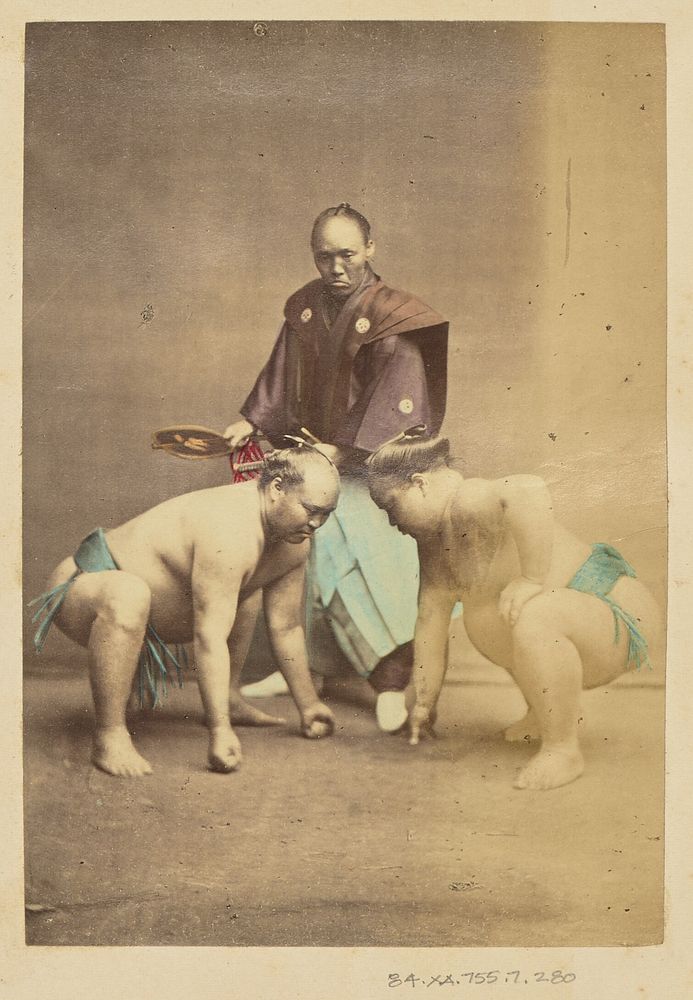 Two Japanese sumo wrestlers posed with referee by Felice Beato and Baron Raimund von Stillfried