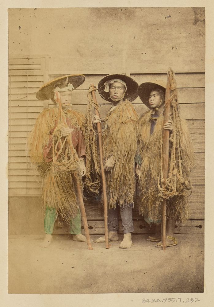 Three Japanese men in grass robes and wide-brimmed hats by Felice Beato and Baron Raimund von Stillfried
