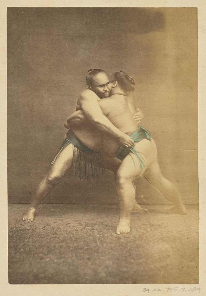 Two Japanese sumo westlers in gappling pose by Felice Beato and Baron Raimund von Stillfried