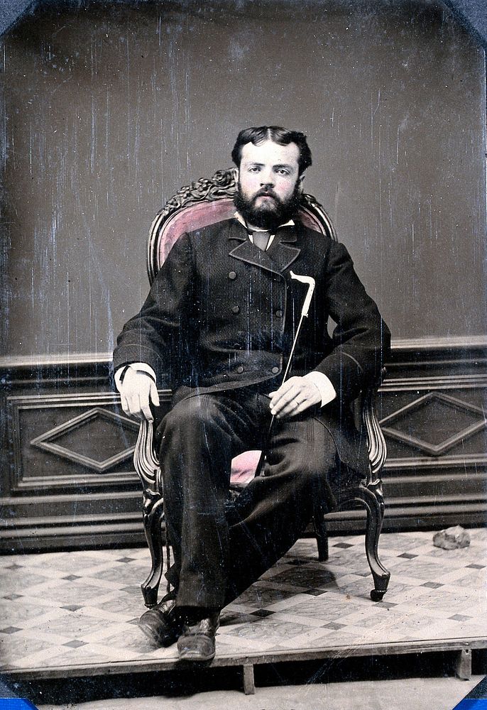 Joseph Dawson seated in a chair: portrait in a studio in San Salvador, the Bahamas. Photograph, 1855/1865.