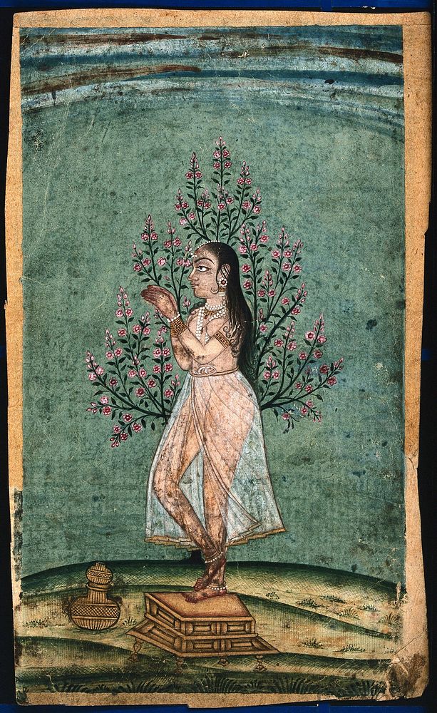 An Indian lady standing next to a tree and praying. Gouache painting by an Indian painter.