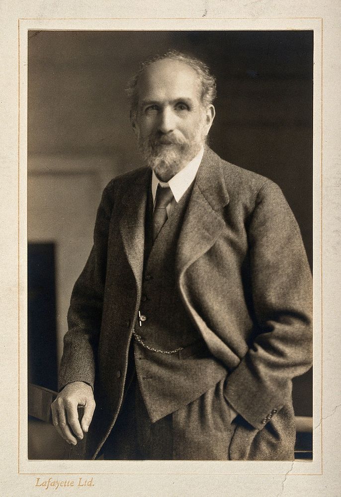 Arthur Schuster, standing, facing forwards. Photograph, c. 1920.