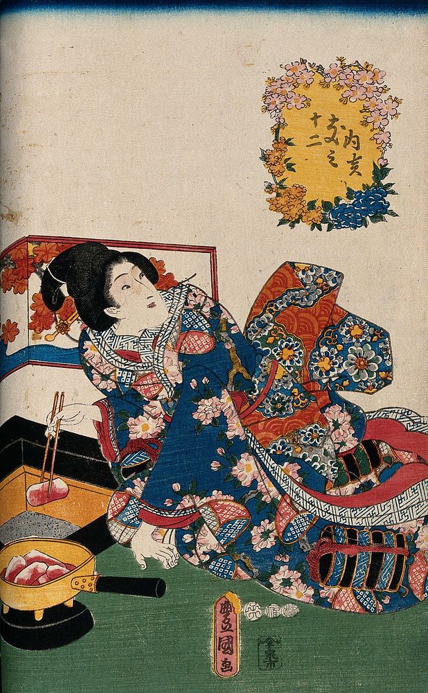 A woman placing glowing charcoal in a sand-filled box to provide warmth. Colour woodcut by Kunisada, 1852.