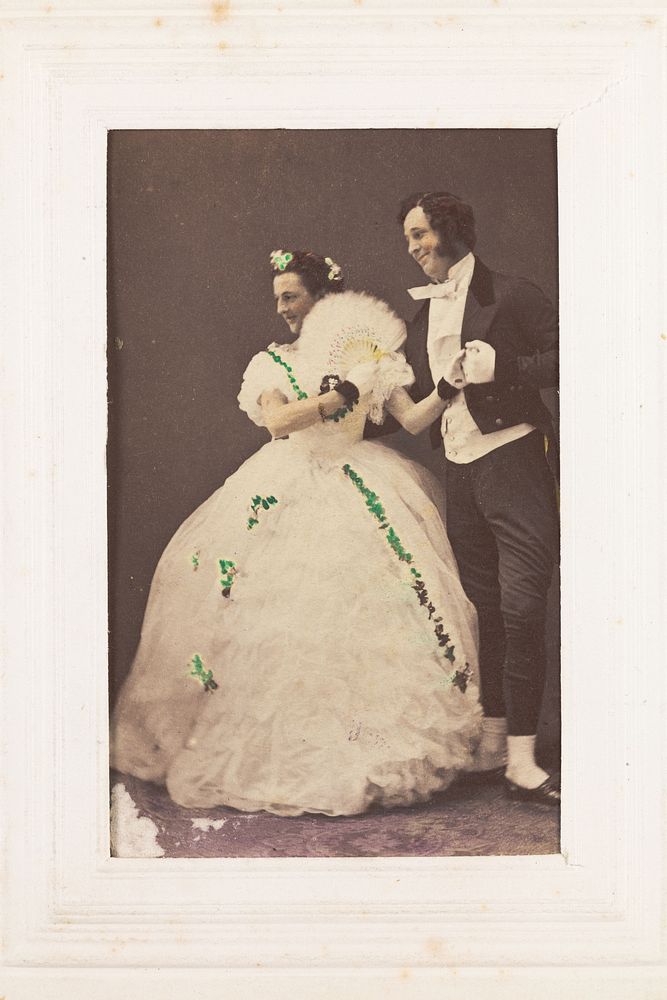 Two men, one in drag, posing as a performing couple. Photograph, 189-.