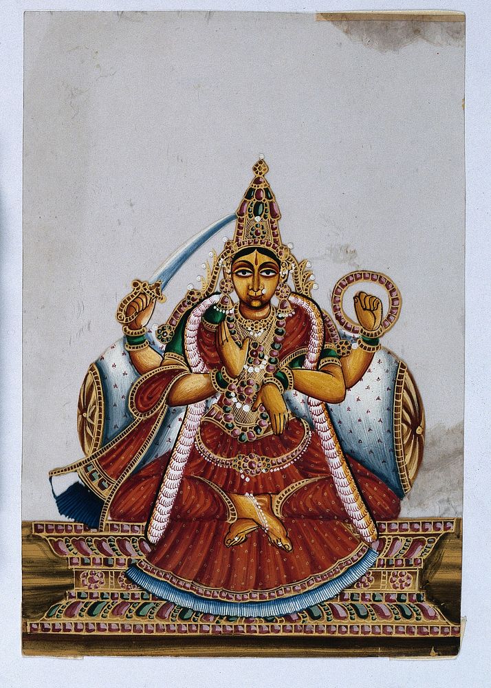 A four armed Indian goddess with her lower right hand raised in a abhaya mudra, upper right holding a sword and her upper…