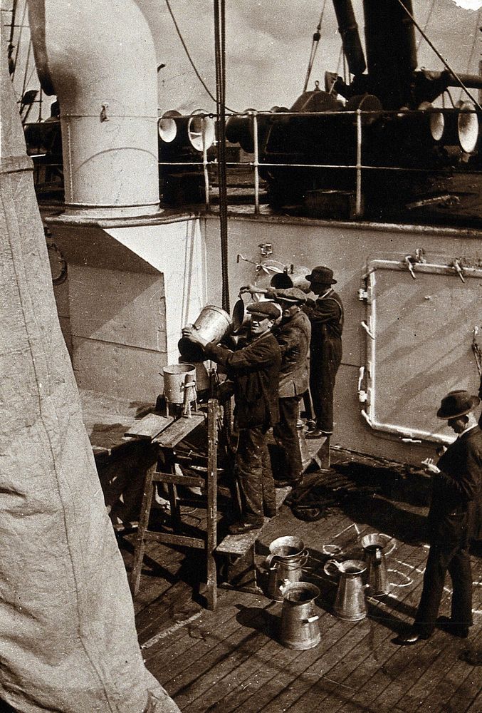Ship fumigation using hydrogen cyanide: operators at work with metal funnels on board the ship. Photograph by P. G. Stock…