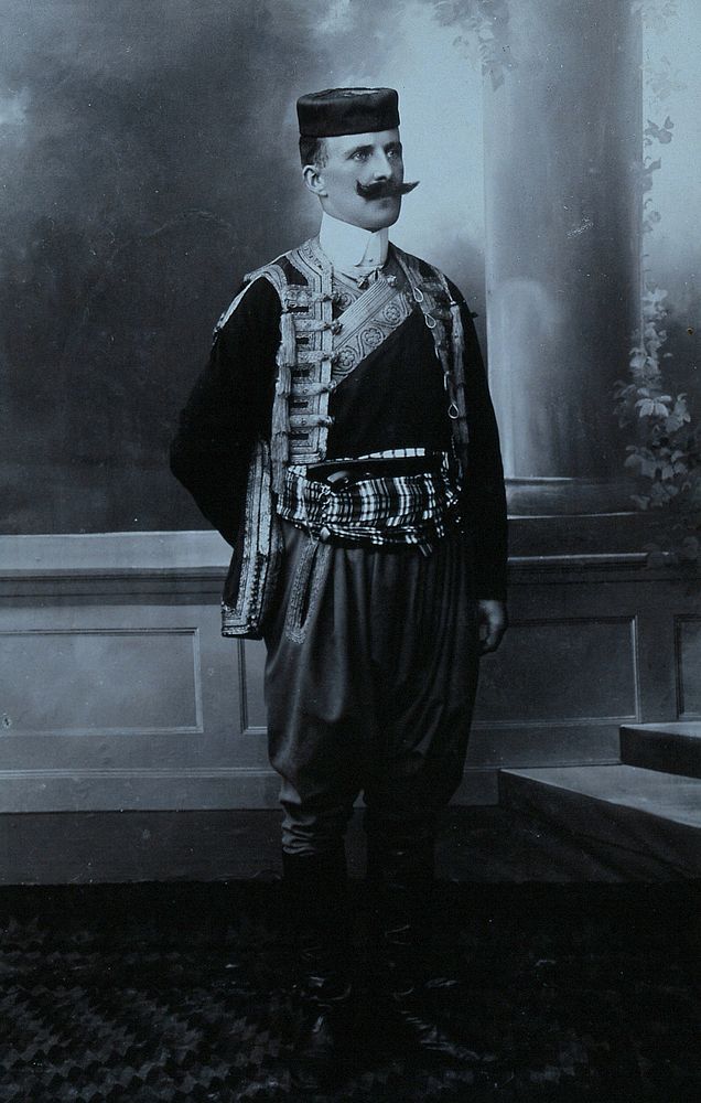 A Montenegrin man wearing national dress and a Montenegrin cap.