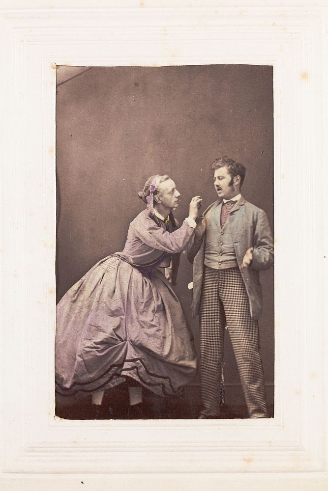 Two men, one in drag, posing in disagreement. Photograph, 189-.