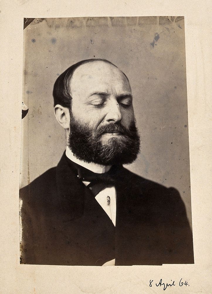 A bearded man, head and shoulders, with his eyes closed. Photograph by L. Haase after H.W. Berend, 1864.