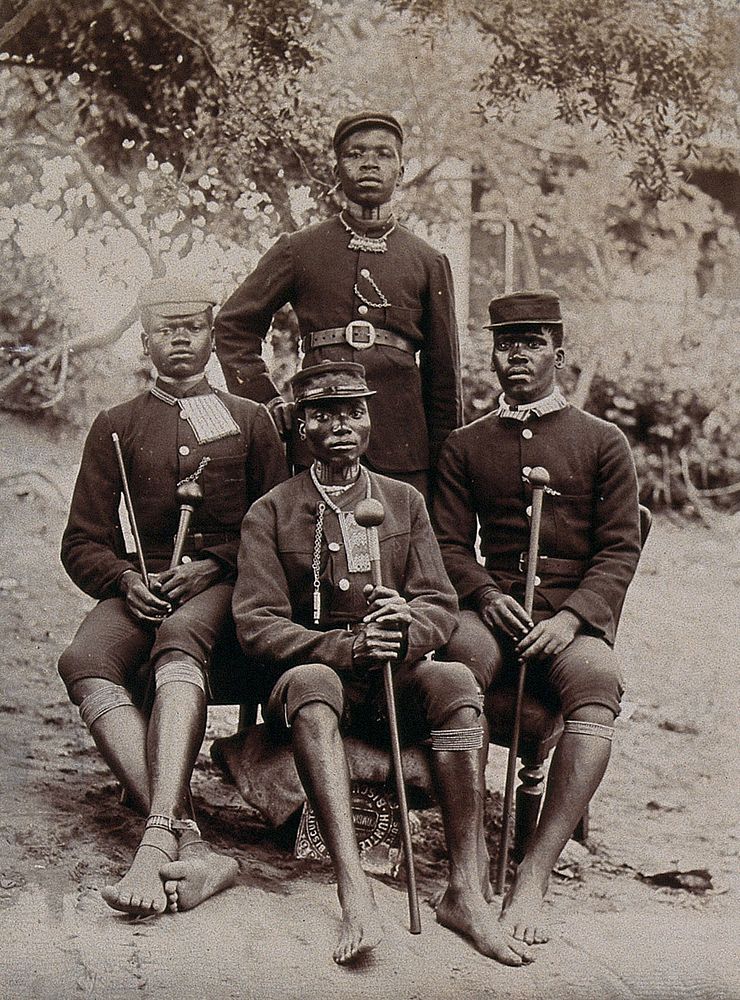 Natal, South Africa: four African policemen in uniform. 1896.