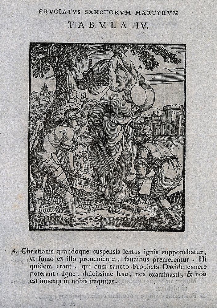 Martyrdom of a male saint, bound to a branch on a tree above a fire. Woodcut.