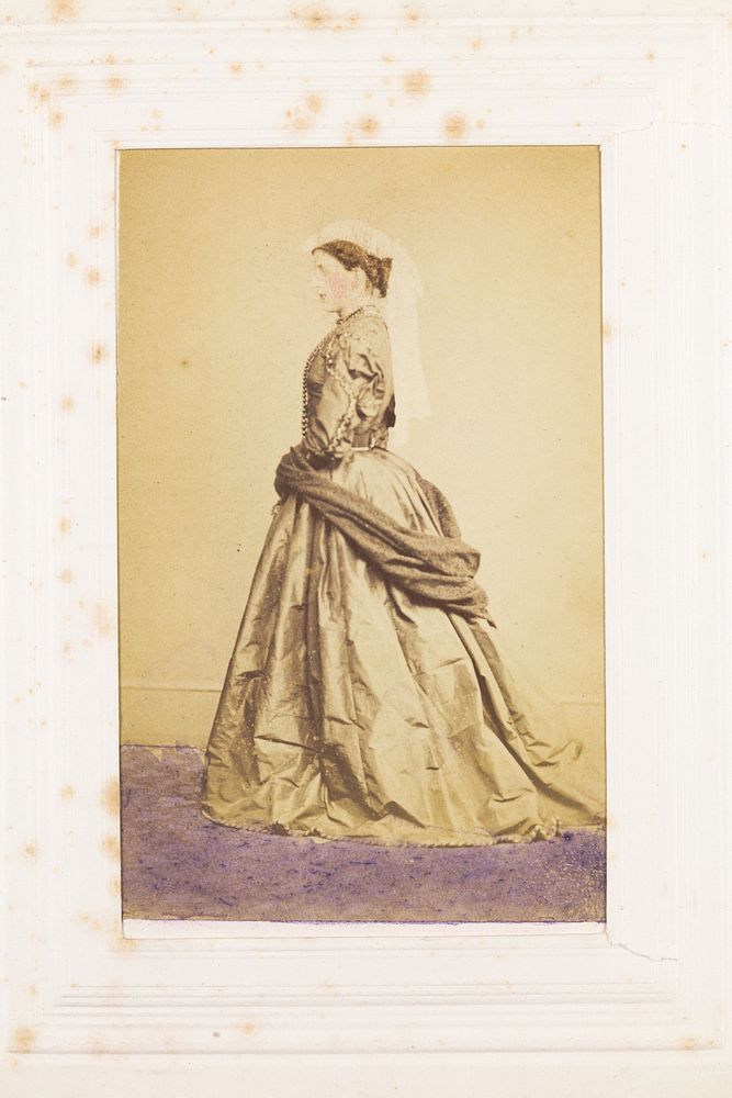 A man in drag posing side-on. Photograph, 189-.