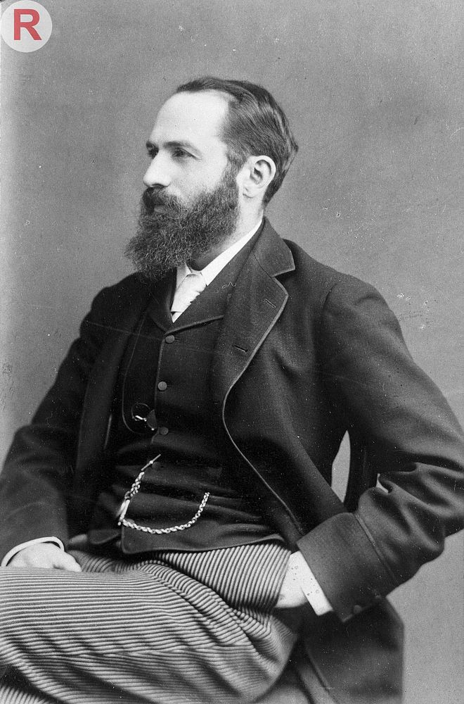 Arthur Schuster, seated, facing right, aged about 45. Photograph by A.J. Melhuish, c. 1896.