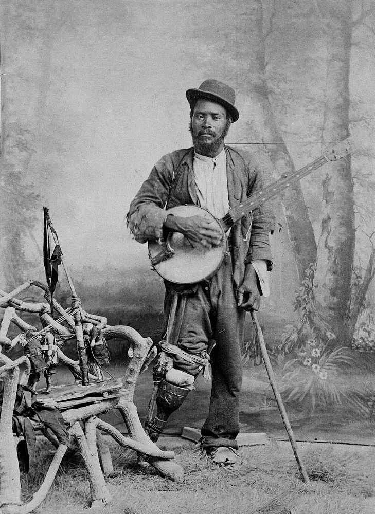 A black banjo player with a wooden leg. Photograph, ca. 1865 .