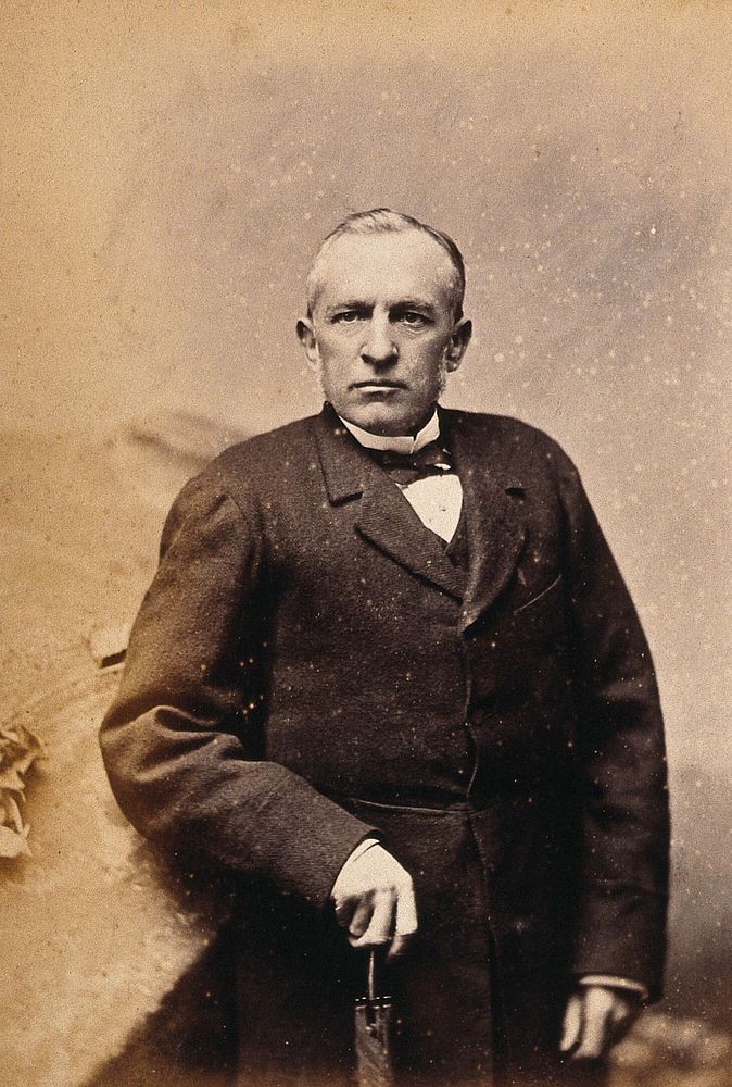 An American man, standing: studio portrait. Photograph, ca. 1880.