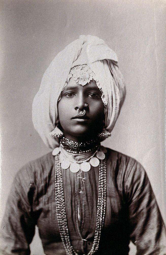 A young Hindu girl, perhaps a princess, in a studio setting.