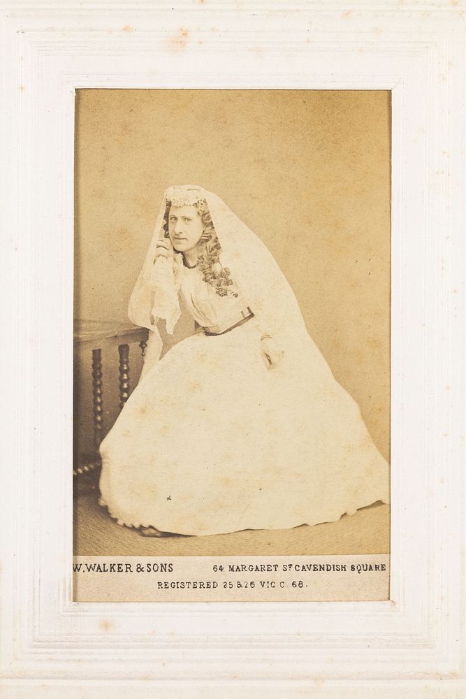 A man in drag dressed as a bride.