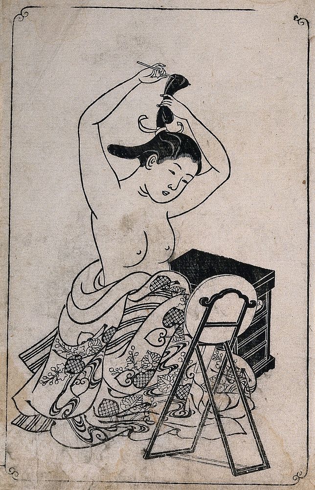 A woman, naked to the waist, dressing her hair before a mirror stand. Woodcut by Sukenobu, 1739.