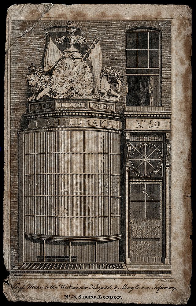 The shopfront of the truss-maker Timothy Sheldrake, at No. 50 The Strand, London; royal coat of arms above the bay window.…