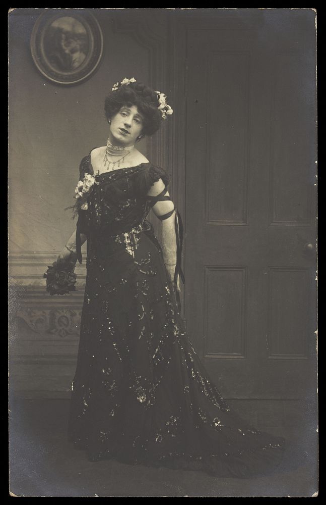 A man in drag. Photographic postcard by Fred C. Palmer, 190-.