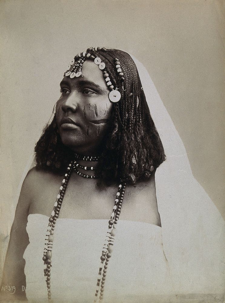 A North African woman with scarification on her cheeks. Photograph attributed to G. Lekegian, ca. 1900.