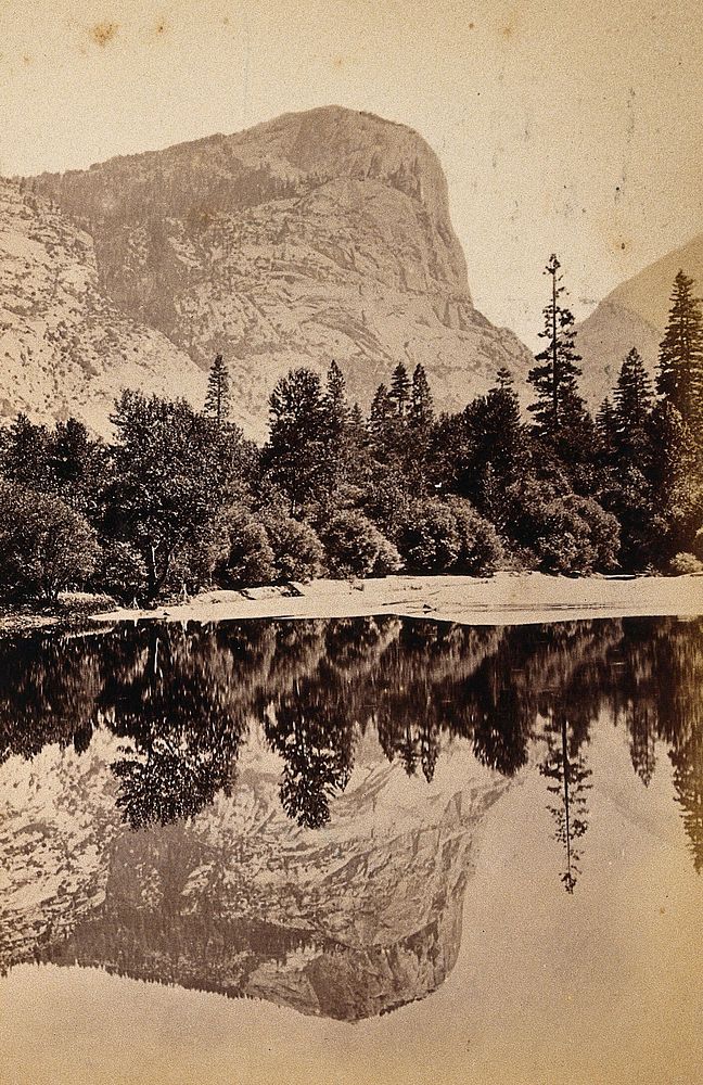 Yosemite National Park, California: Glacier Point with its reflection showing in Mirror Lake: panoramic view: section two.…