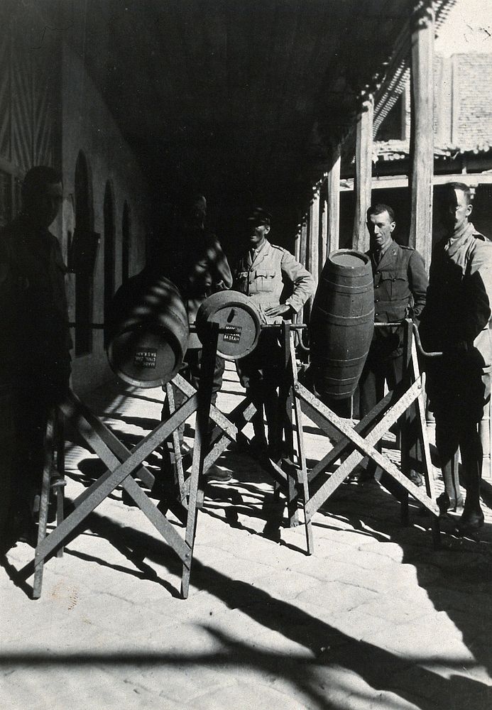 Water chlorinating apparatus with Western men in military uniform. Photograph, 1905/1915.
