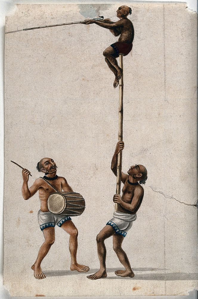 An acrobat climbing a pole held by another man while a musician drums out a beat. Gouache painting by an Indian painter.