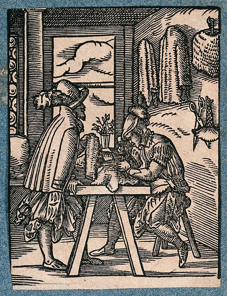 A man is working at a table making chain-mail, greaves and other defensive armour; another man inspects a product. Woodcut…