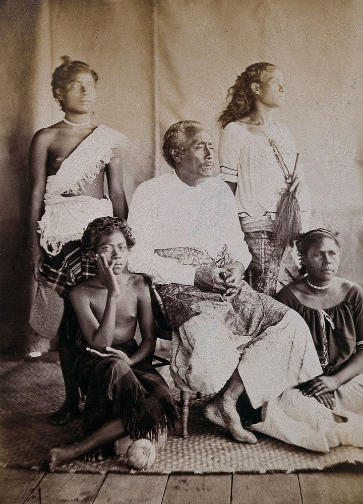 Enele Maʻafu, a Tongan prince, seated with four attendants. Photograph, ca. 1880.