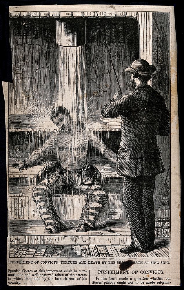 A prisoner in Sing Sing Prison, New York, having water poured over him by a guard as a punishment, while restrained at the…