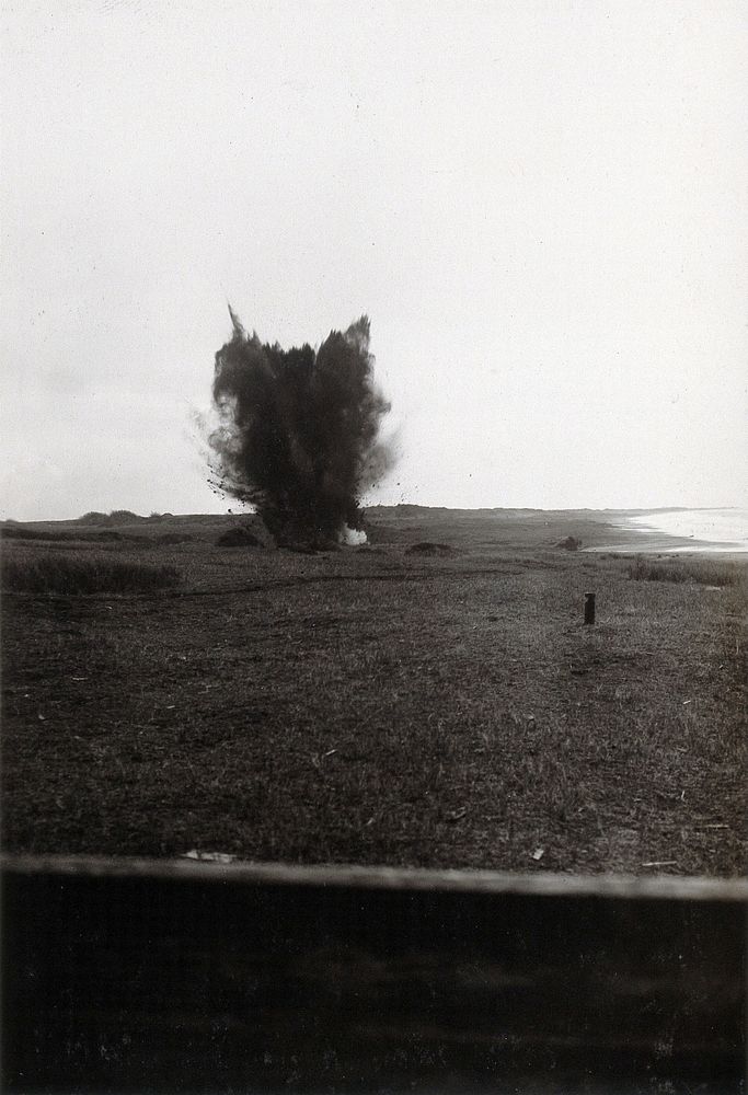 Nettuno, Italy: an explosion of black smoke in a field. Photograph, 1918/1937 .