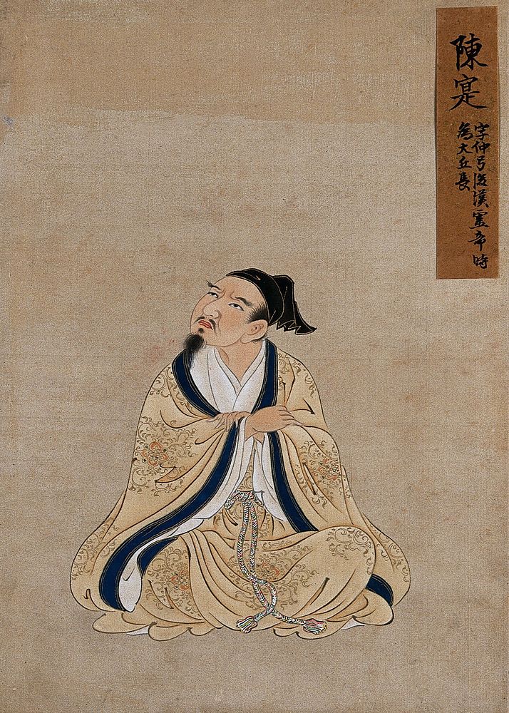 A Chinese seated figure, full frontal, with grey beard, buff coloured robes with a blue border and wearing a black cap.…