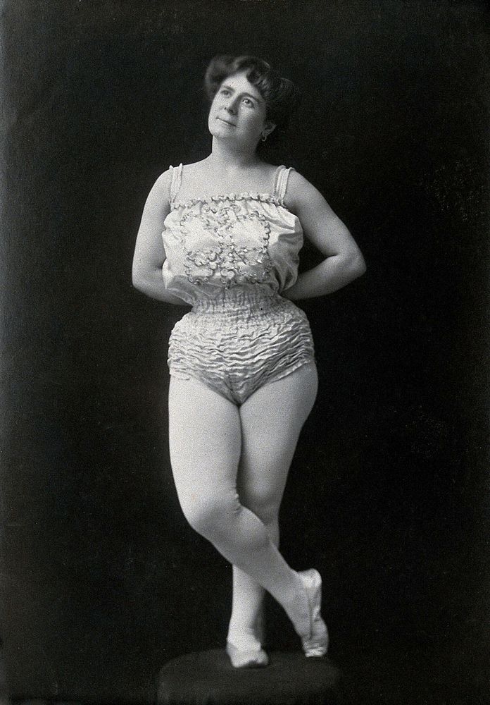 A Bulgarian female acrobat wearing a leotard and tights.