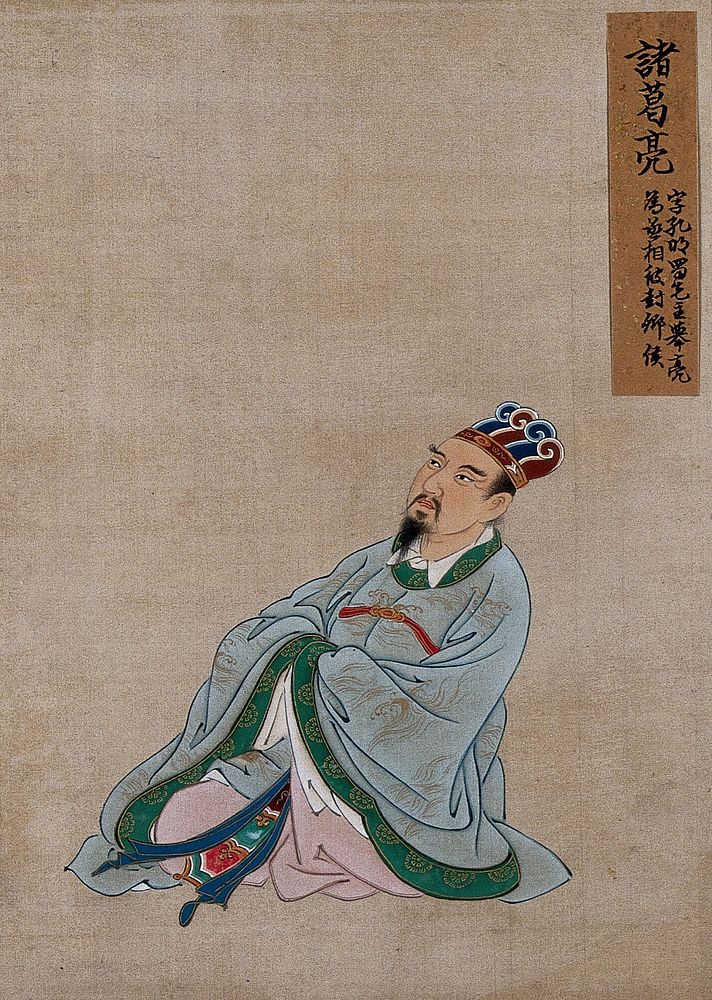 A Chinese figure wearing pale blue silk robes with a emerald green border and elaborate head-dress. Painting by a Chinese…