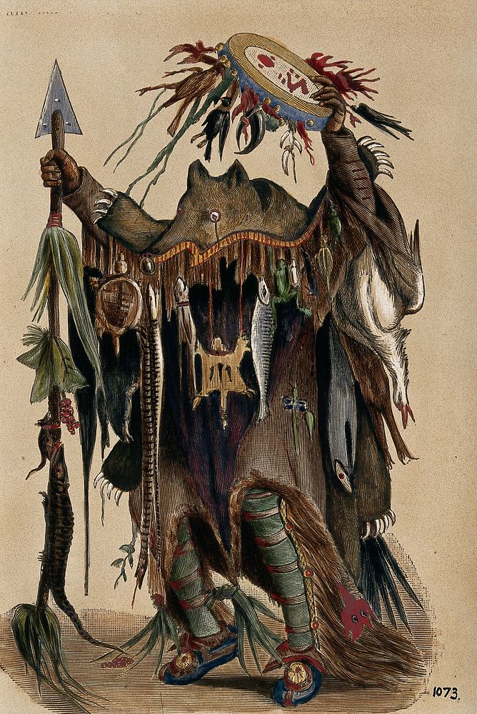 A Blackfoot Indian medicine man. Coloured photograph, ca. 1913.