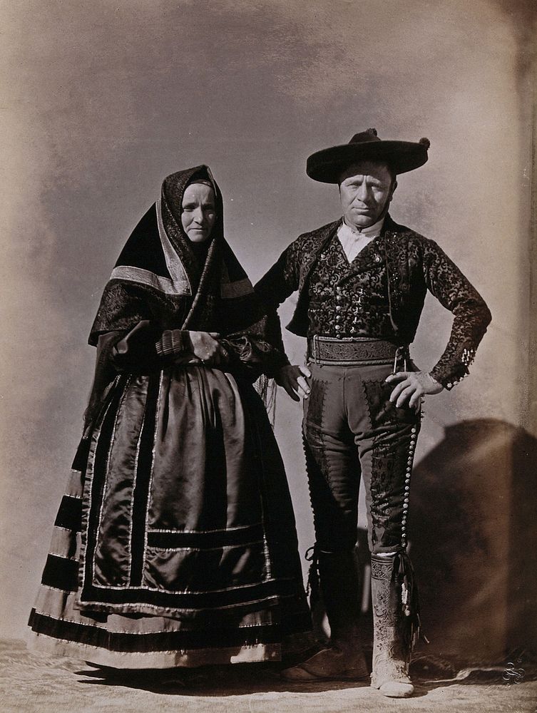 People of Segovia, a man and woman wearing traditional dress.