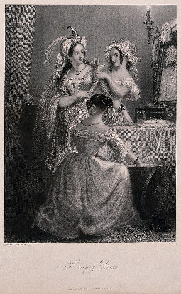 Three young women are dressing in ornate clothes in front of a dressing table. Engraving by W.H. Mote after Edward Corbould.