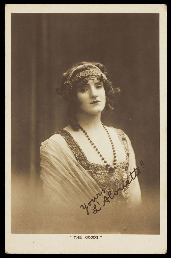 Private Webster (known as L'Alouette) in drag, posing for a portrait. Photographic postcard, ca. 1916.