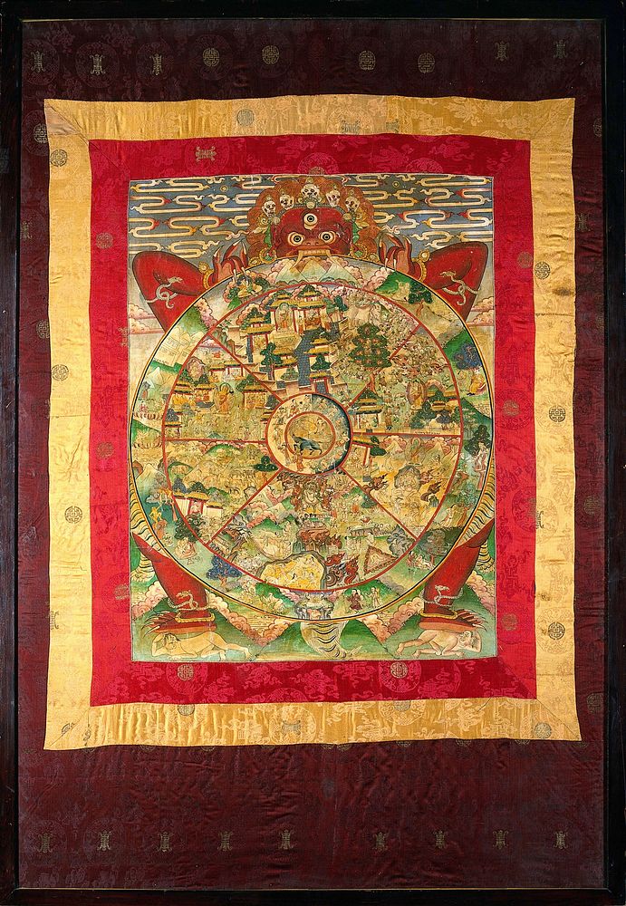 Yama, the Lord of Death, holding the Wheel of Life which represents Samsara, or the world on a Tibetan Thangka. In the…