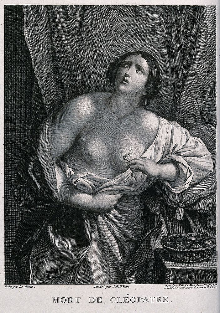 The suicide of Cleopatra: Cleopatra is standing next to her bed holding the asp in her left hand. Line engraving by N. Mire…