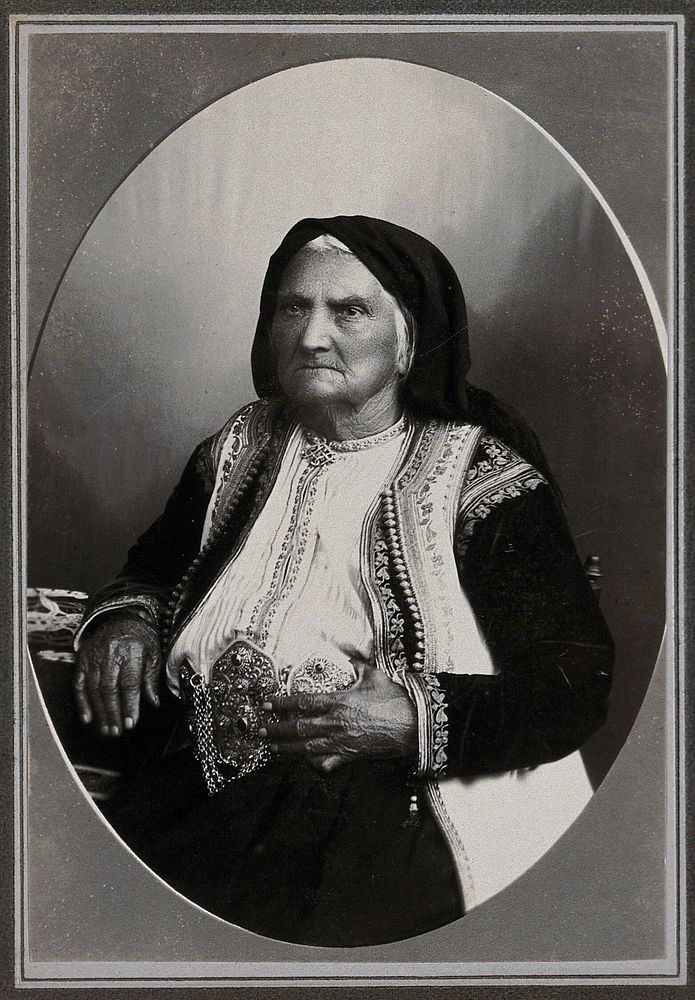 A Montenegrin woman wearing national dress with a large metal belt.