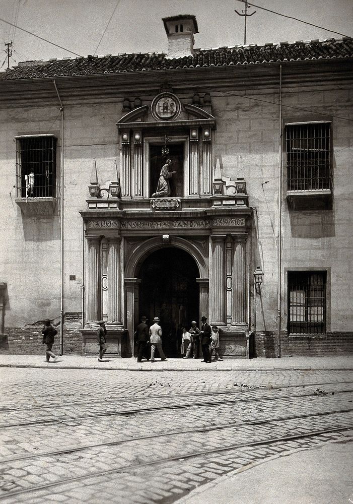Hospital San Juan de Diós, Granada: gateway of the hospital showing the stone figure of the founder above. Photograph…