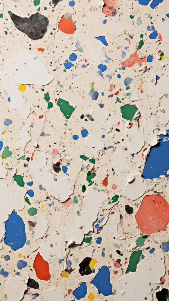 Terrazzo with some paint on it paper confetti wall.