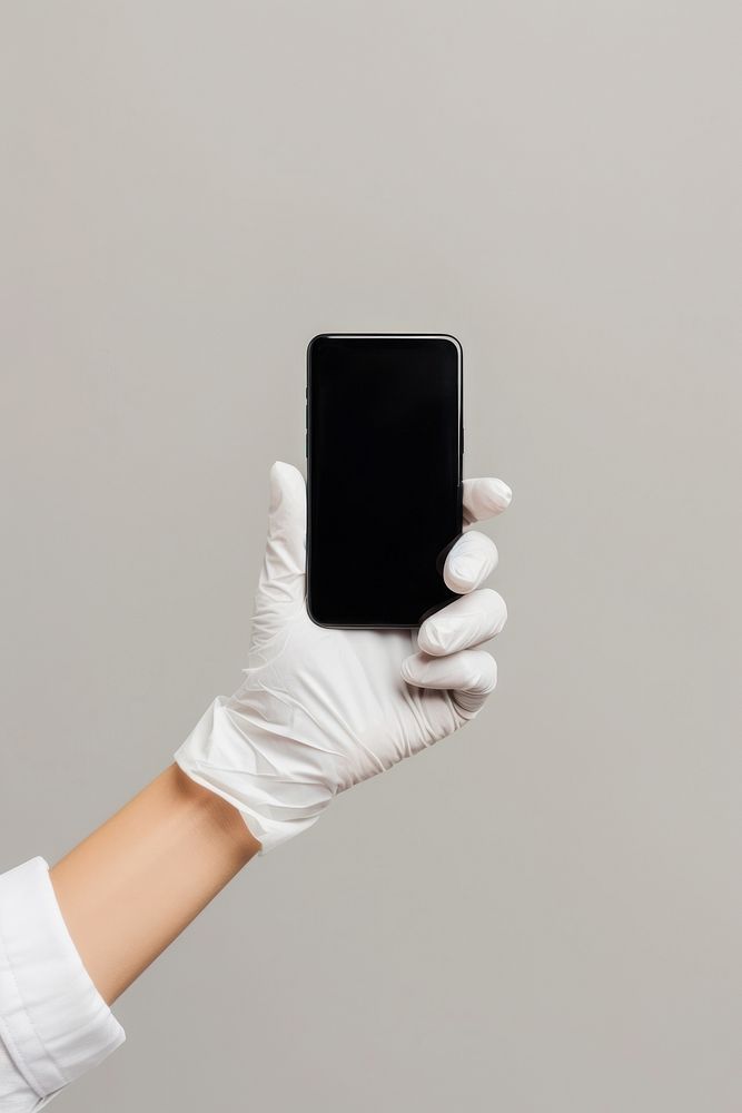 Hand wear rubber glove holding mobile phone screen photographing electronics.