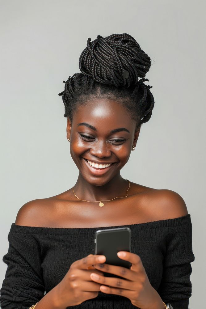 African woman holding cellphone portrait smiling adult.