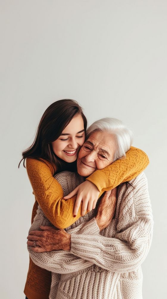 Daughter embrace old mother hugging sweater affectionate.