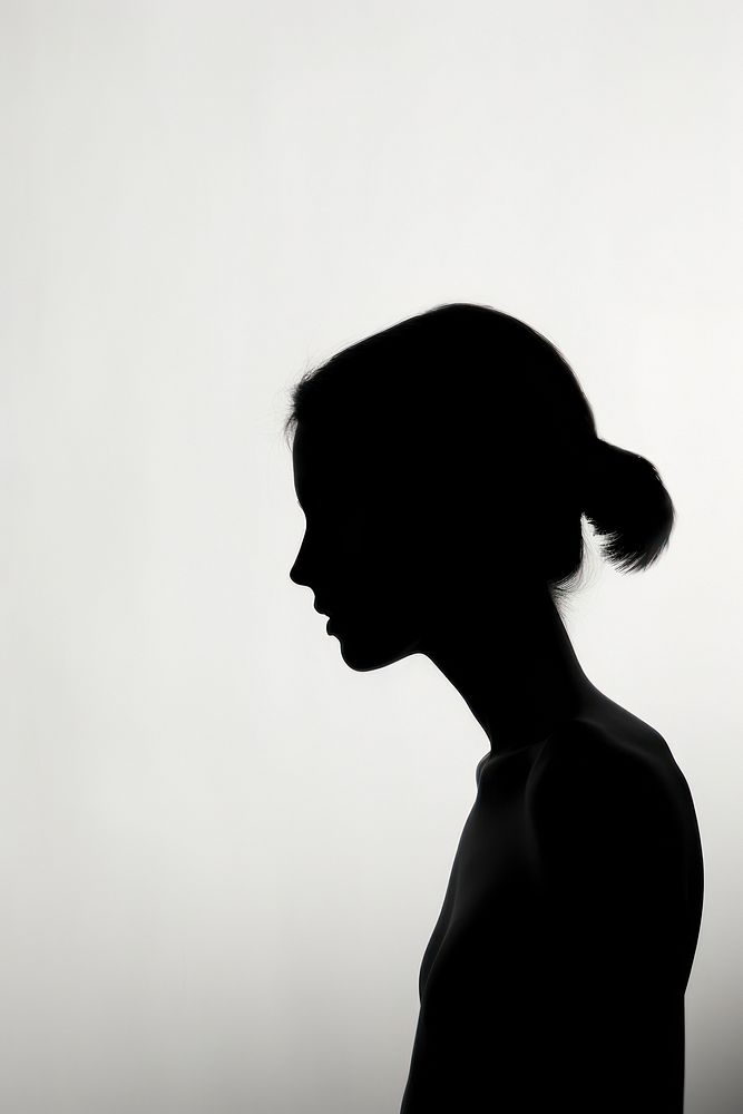 Human silhouette on solid background backlighting adult contemplation.