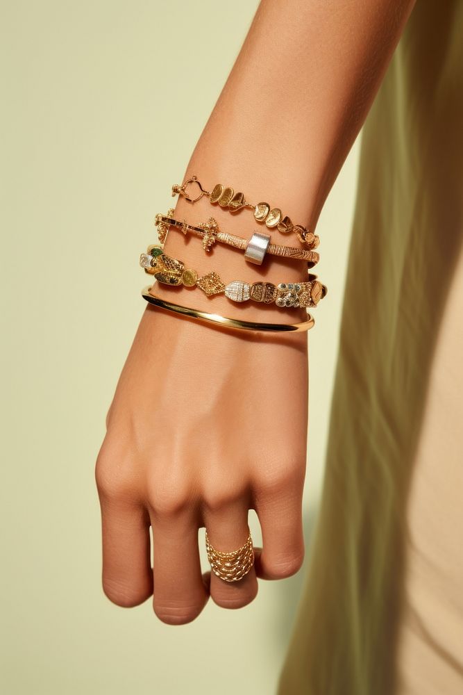 Jewelry on wrists bracelet ring studio shot.